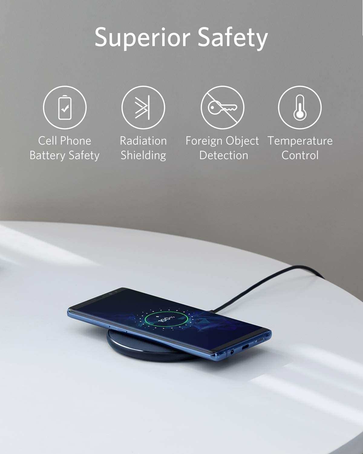 Anker PowerWave Wireless Charger Pad charging smartphone and earbuds wirelessly with universal compatibility and through-case charging features